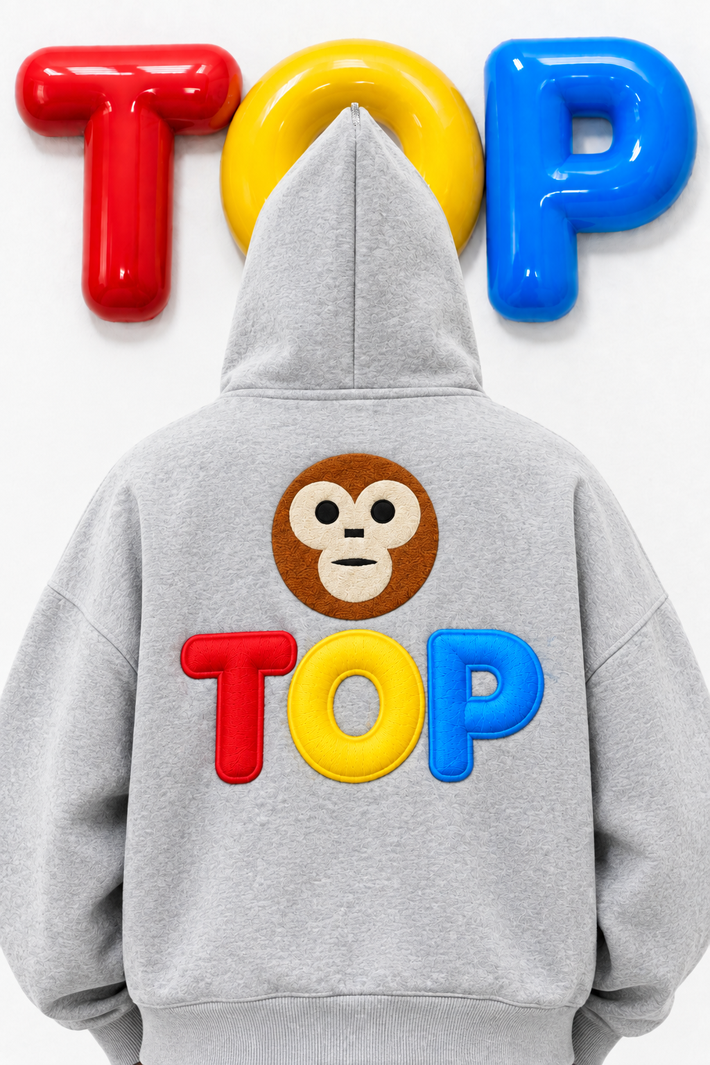 Grey TOP hoodie back view straight, monkey face and TOP puff letters, glossy TOP wall
