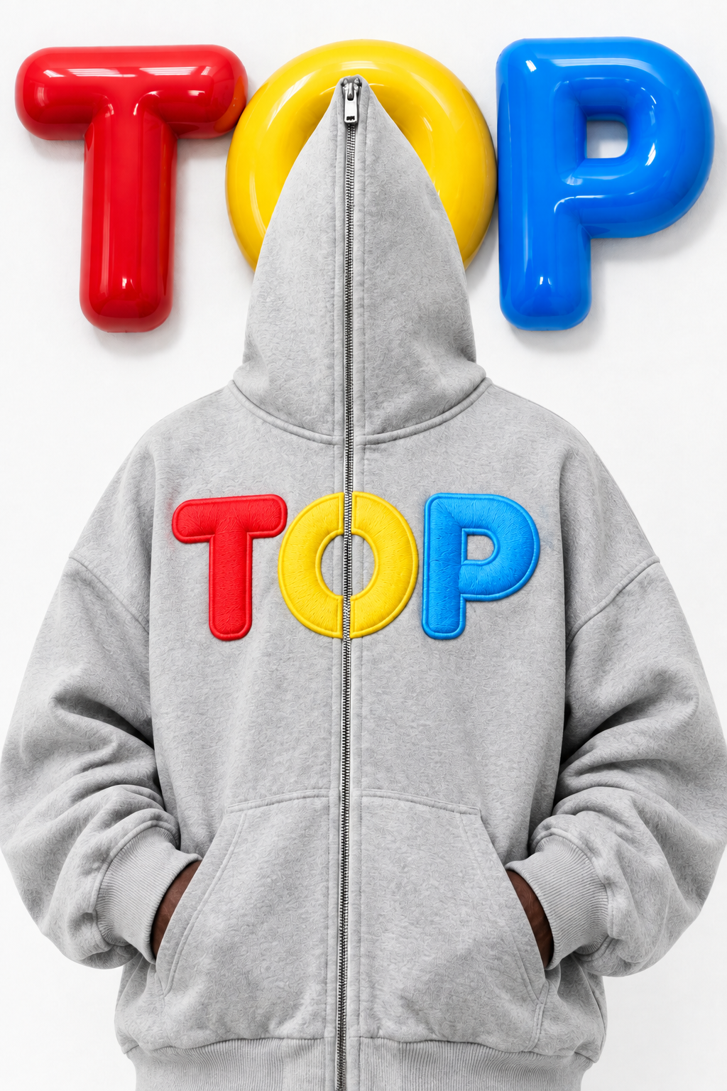 Naija male in the grey TOP zip hoodie with puff letters on chest, hood zipped over the face, tight chest crop